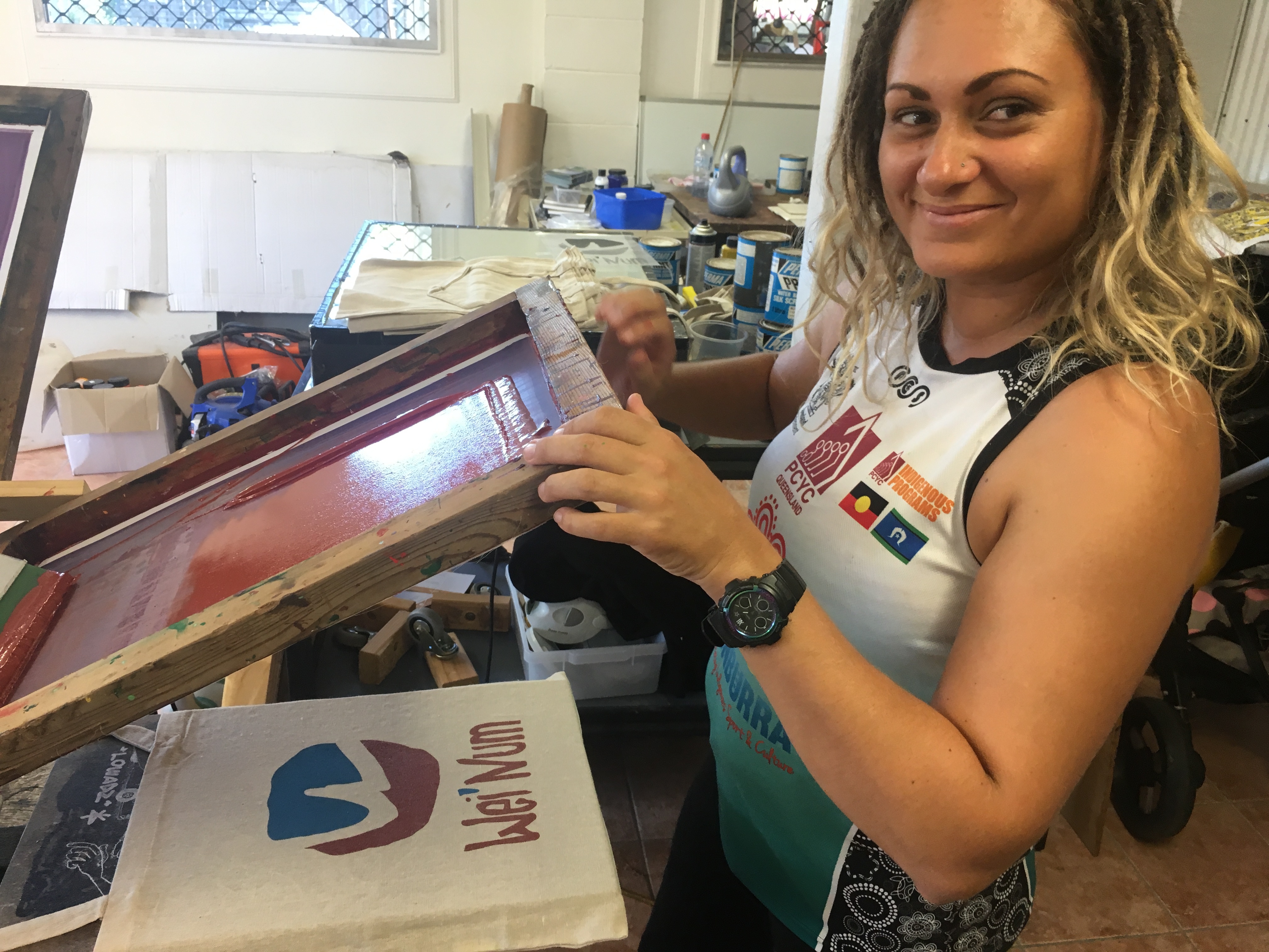 Artist Luanna de Jersey screen printing at Black Square Arts Studio, Cairns, 2019